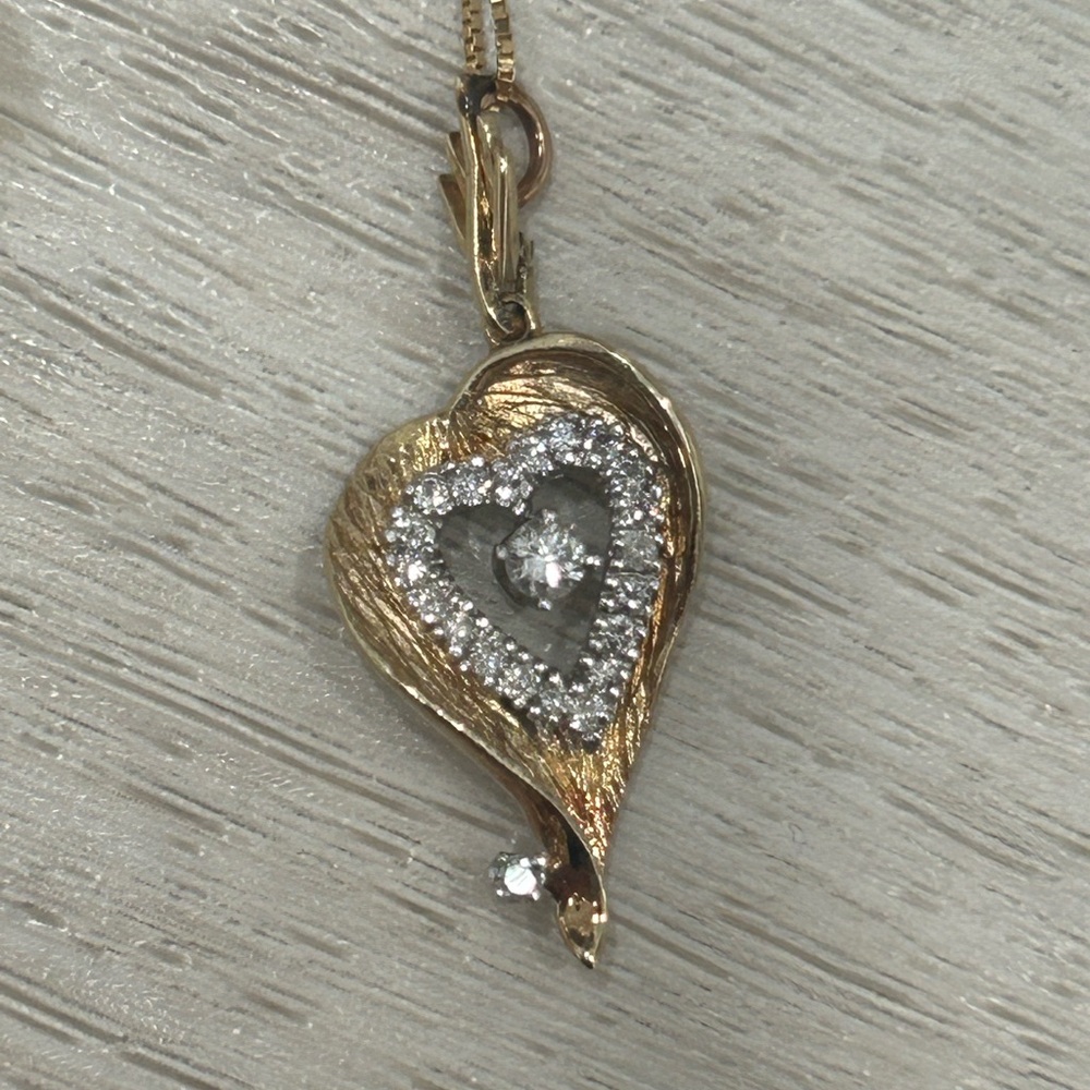 14 karat yellow gold necklace with diamond fancy open heart pendant